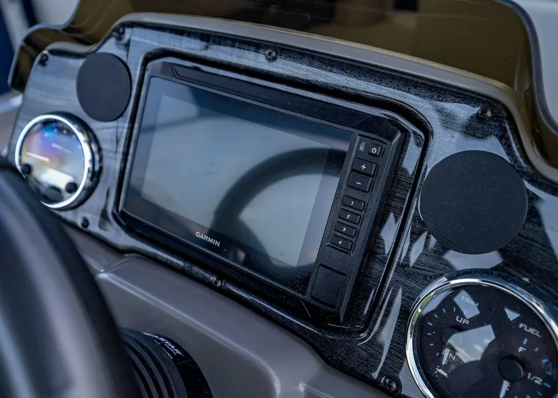 Slide: The Image of Dashboard of 2025 Tahoe SPORTS 85 REAR FISH boat with Garmin display and gauges. - 13