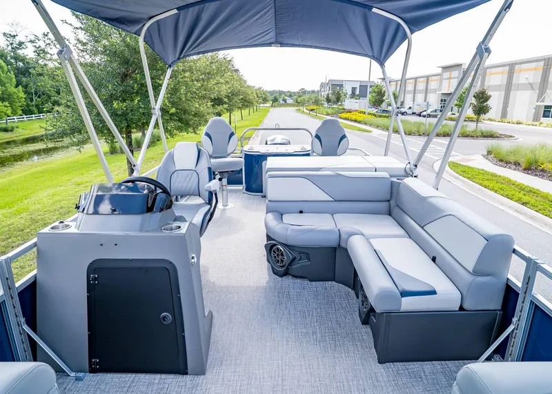 Slide: The Image of 2025 Tahoe SPORTS 85 REAR FISH boat interior with seating and steering console. - 14