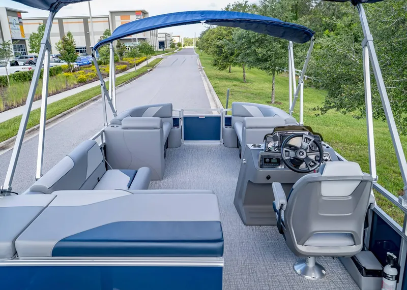 Slide: The Image of 2025 Tahoe SPORTS 85 REAR FISH boat interior with seating and steering console. - 22