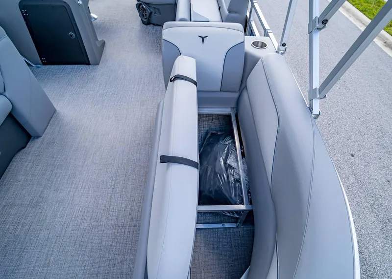 Slide: The Image of 2025 Tahoe SPORTS 85 REAR FISH boat interior with open storage compartment. - 23