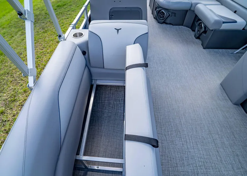 Slide: The Image of 2025 Tahoe SPORTS 85 REAR FISH boat interior with gray seating and flooring. - 24