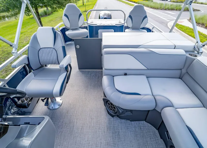 Slide: The Image of 2025 Tahoe SPORTS 85 REAR FISH boat interior with plush seating and modern design. - 25
