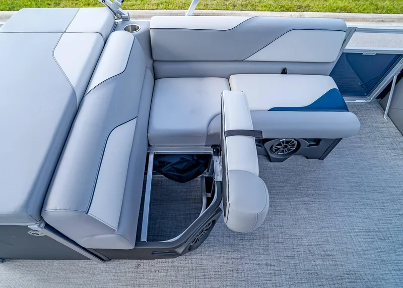 Slide: The Image of 2025 Tahoe SPORTS 85 REAR FISH boat interior with gray seating and storage compartment. - 26