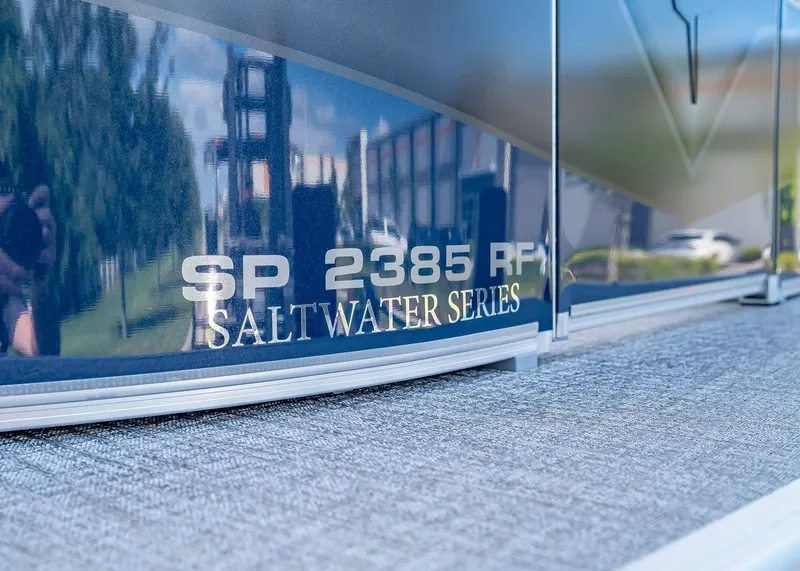 Slide: The Image of 2025 Tahoe SPORTS 85 REAR FISH boat, SP 2385 RF Saltwater Series branding. - 32