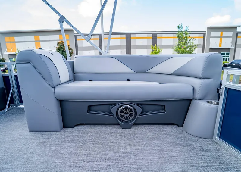 Slide: The Image of 2025 Tahoe SPORTS 85 REAR FISH boat interior with gray seating and speaker. - 9