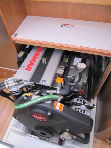 Slide: The Image of 2024 Catalina 385 engine compartment with Yanmar engine, showcasing detailed components and layout. - 25