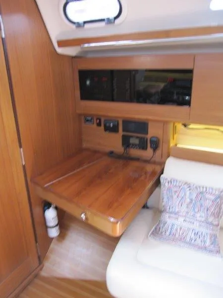 Slide: The Image of 2024 Catalina 385 yacht interior with wooden desk and seating area. - 26