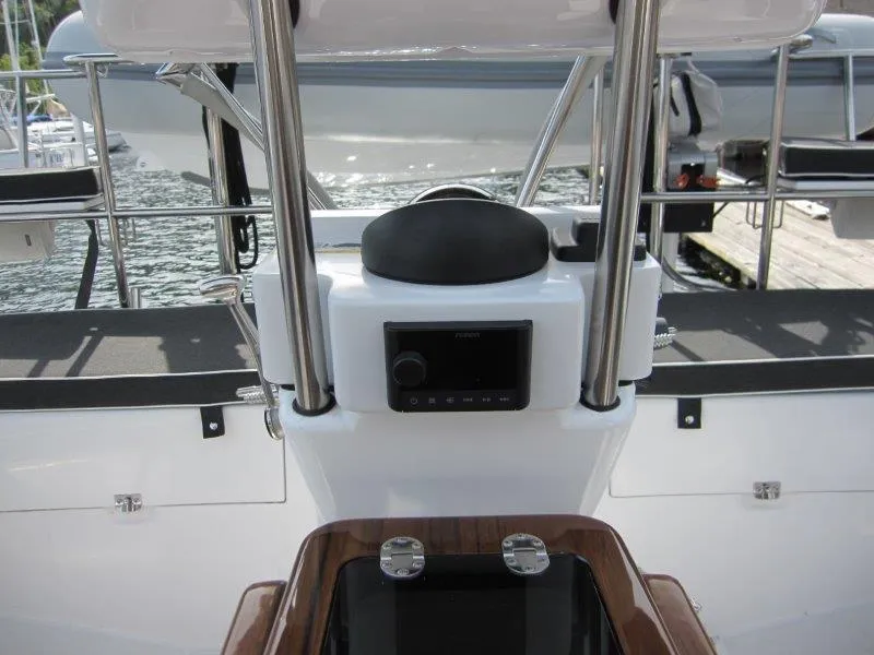 Slide: The Image of 2024 Catalina 385 yacht helm with modern navigation equipment and sleek design. - 33