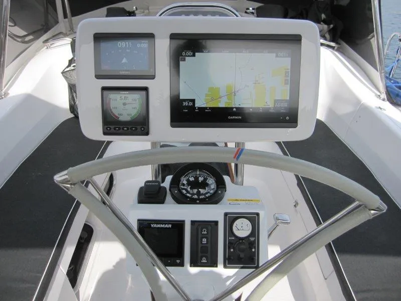 Slide: The Image of Cockpit of 2024 Catalina 385 sailboat with navigation instruments and steering wheel. - 37