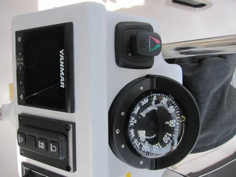 Slide: The Image of Compass and control panel on 2024 Catalina 385 sailboat. - 38