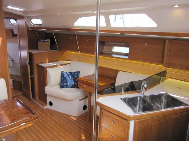 Slide: The Image of Interior of 2024 Catalina 385 sailboat with wood finish and modern amenities. - 9