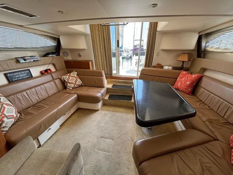 Slide: The Image of Luxurious interior of 2002 Carver 350 Mariner yacht with plush seating and elegant decor. - 12