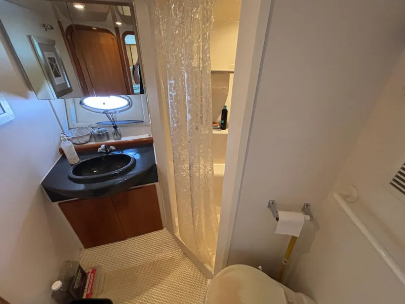 Slide: The Image of Bathroom interior of 2002 Carver 350 Mariner yacht with sink, shower, and toilet. - 15