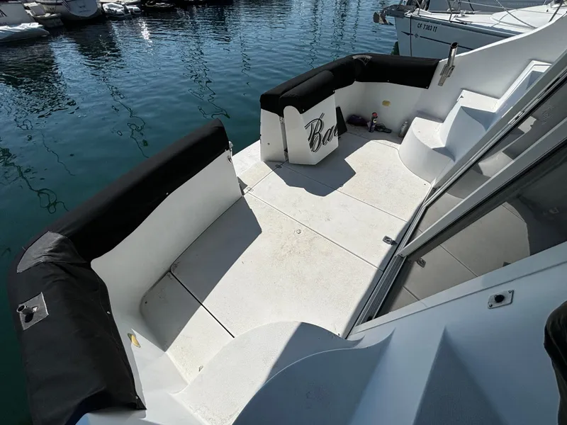 Slide: The Image of 2002 Carver 350 Mariner boat deck with seating, docked at marina. - 3
