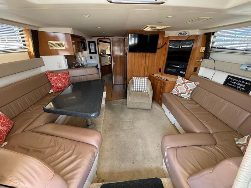 Slide: The Image of Luxurious interior of 2002 Carver 350 Mariner yacht with plush seating and modern amenities. - 9