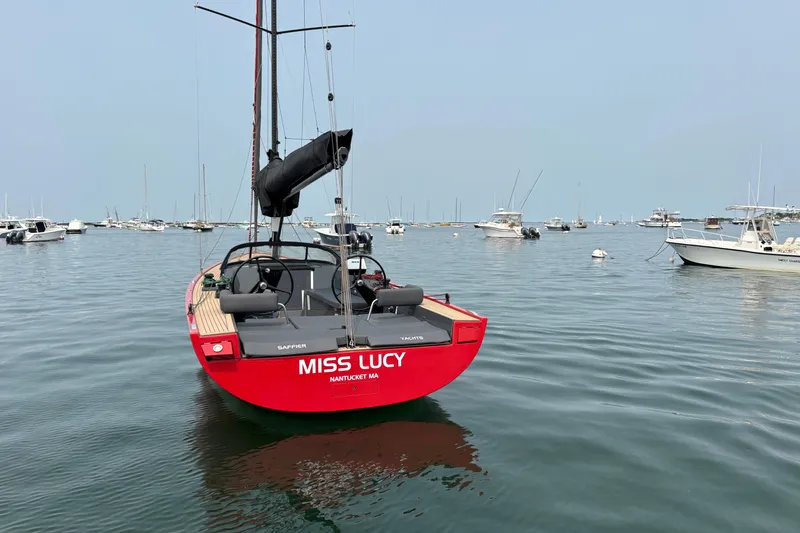 Slide: The Image of Red 2023 Saffier 33 Life sailboat named "Miss Lucy" in a calm harbor. - 2