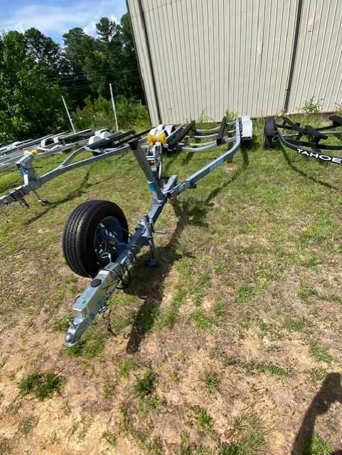 Slide: The Image of Boat trailer for 2006 Scout 222 Sportfish on grassy area near building. - 10