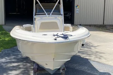 Slide: The Image of 2006 Scout 222 Sportfish boat on trailer, parked outdoors. - 13