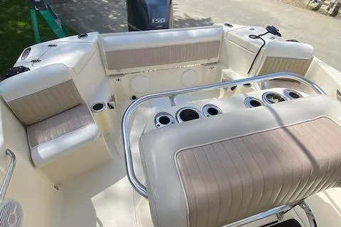 Slide: The Image of 2006 Scout 222 Sportfish boat interior with seating and rod holders. - 14