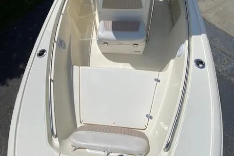 Slide: The Image of 2006 Scout 222 Sportfish boat interior with seating and storage compartments. - 15