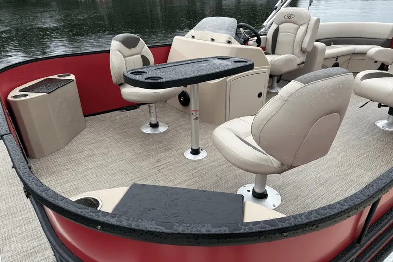 Slide: The Image of 2025 Bentley Pontoons 200 CWT FISH interior with beige seating and fishing table. - 2