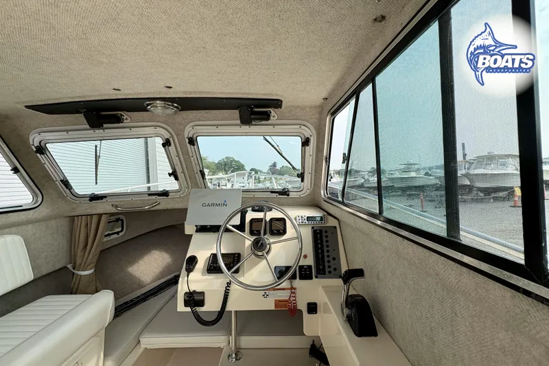 Slide: The Image of Interior of 2011 Parker Sport Cabin SL boat with Garmin navigation system. - 14