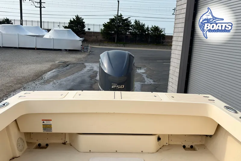 Slide: The Image of 2011 Parker Sport Cabin SL boat with Yamaha 250 engine at dockside. - 18