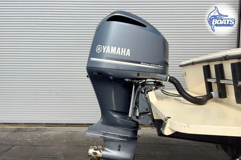 Slide: The Image of Yamaha outboard motor on 2011 Parker Sport Cabin SL boat, side view. - 21
