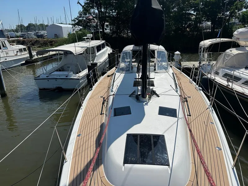 Slide: The Image of 2024 J Boats J/40 sailboat docked, featuring sleek deck design and modern fittings. - 9