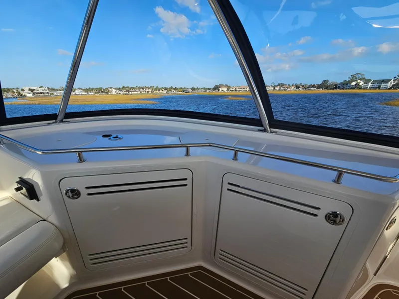 Slide: The Image of Interior view of 2006 Sea Ray 580 Sedan Bridge with scenic water backdrop. - 14