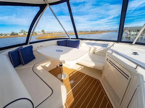 Slide: The Image of Luxurious interior of 2006 Sea Ray 580 Sedan Bridge yacht with scenic water views. - 23