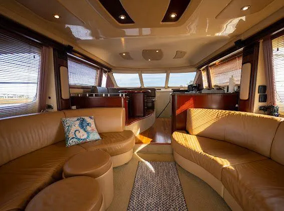 Slide: The Image of Luxurious interior of 2006 Sea Ray 580 Sedan Bridge yacht with leather seating. - 36