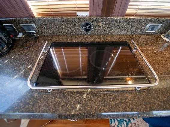 Slide: The Image of Granite countertop with built-in stove on 2006 Sea Ray 580 Sedan Bridge yacht. - 41