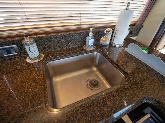 Slide: The Image of Luxury yacht kitchen sink on 2006 Sea Ray 580 Sedan Bridge with granite countertop. - 42