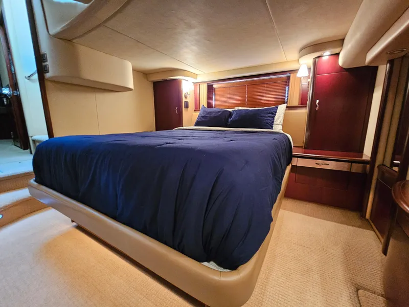 Slide: The Image of Luxurious bedroom interior of 2006 Sea Ray 580 Sedan Bridge yacht. - 48