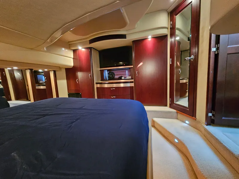 Slide: The Image of Luxurious interior of 2006 Sea Ray 580 Sedan Bridge yacht bedroom. - 49