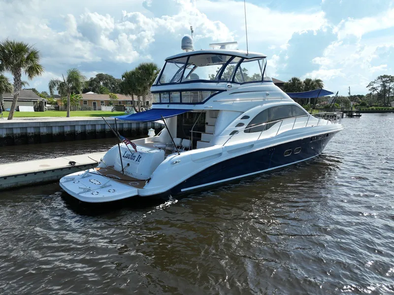 Slide: The Image of 2006 Sea Ray 580 Sedan Bridge yacht docked on a sunny day. - 5