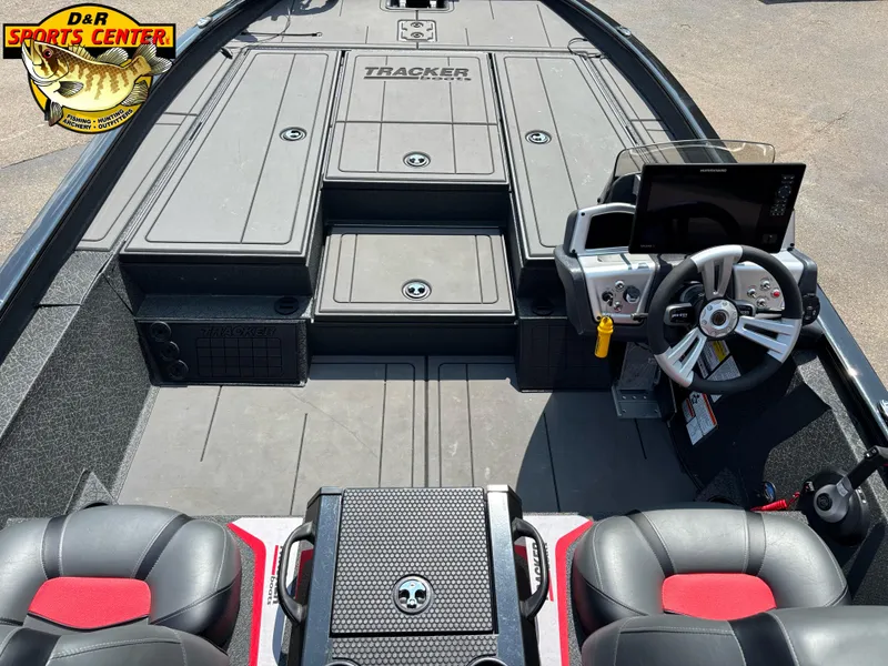 Slide: The Image of 2025 Tracker Savage 215 boat interior with steering console and seating at D&R Sports Center. - 5