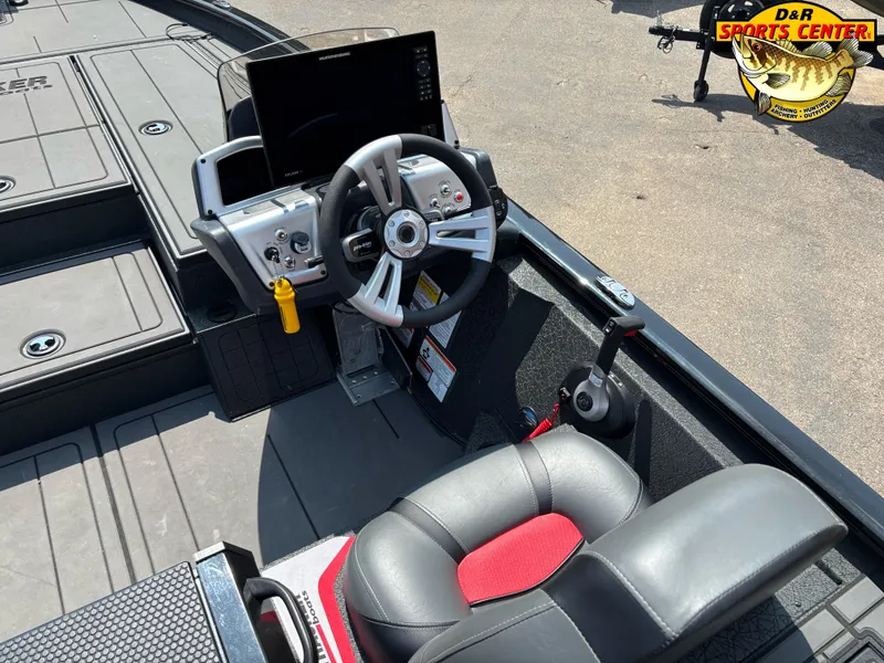 Slide: The Image of 2025 Tracker Savage 215 boat cockpit with steering wheel and control panel. - 6