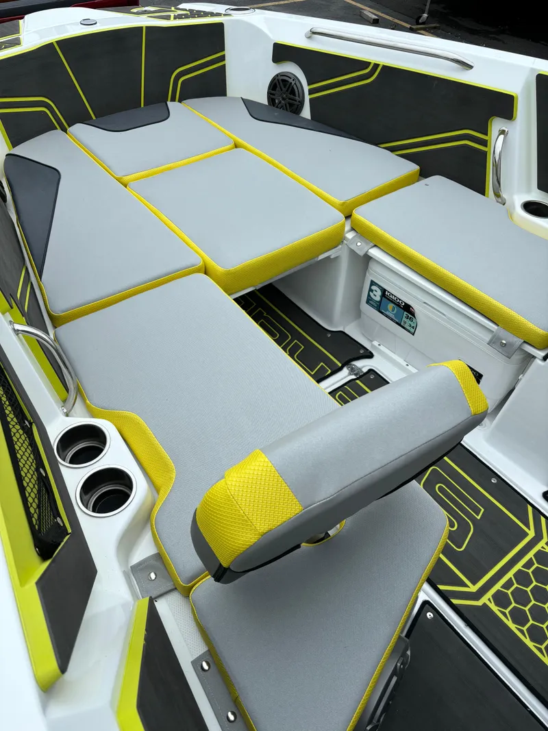 Slide: The Image of 2025 Scarab 255 Open SE boat interior with gray and yellow seating. - 9