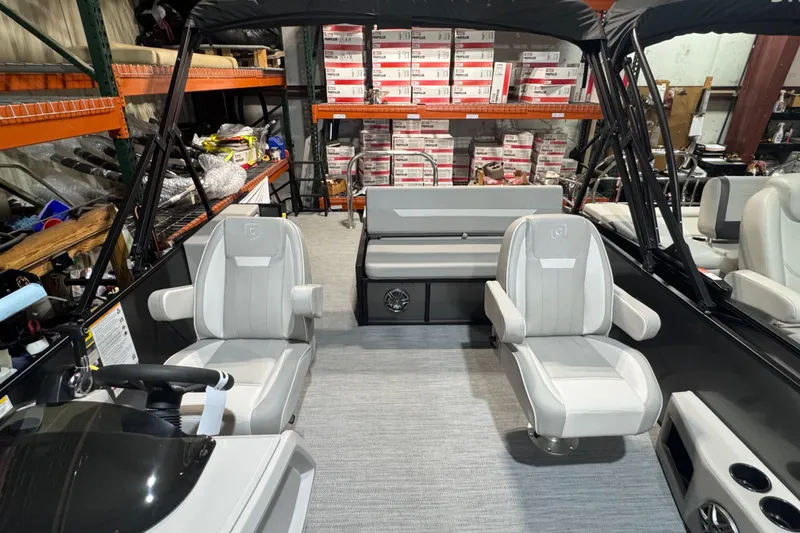 Slide: The Image of 2025 Godfrey Xperience EX2286SFLX boat interior with modern seating and storage. - 12