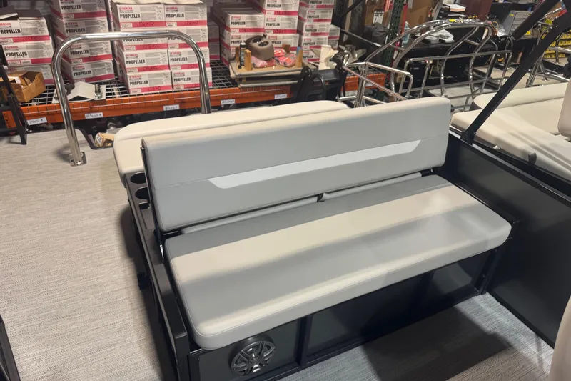 Slide: The Image of 2025 Godfrey Xperience EX2286SFLX boat seat in showroom with Yamaha propeller boxes. - 15