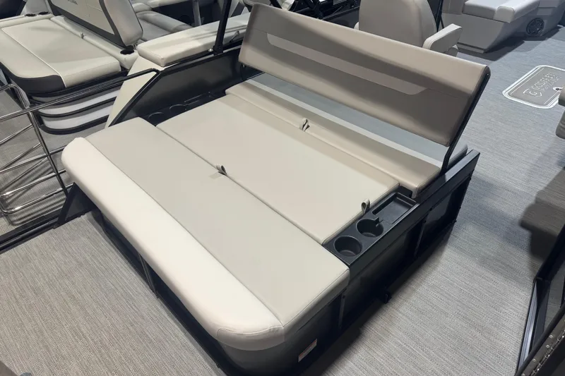Slide: The Image of 2025 Godfrey Xperience EX2286SFLX boat interior with comfortable seating and cup holders. - 16