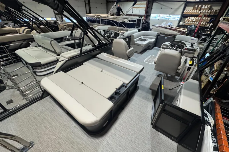 Slide: The Image of 2025 Godfrey Xperience EX2286SFLX pontoon boat interior with modern seating and controls. - 17