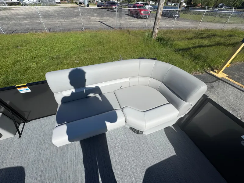 Slide: The Image of 2025 Godfrey EX2286SFLX boat with gray seating and shadow on deck. - 3