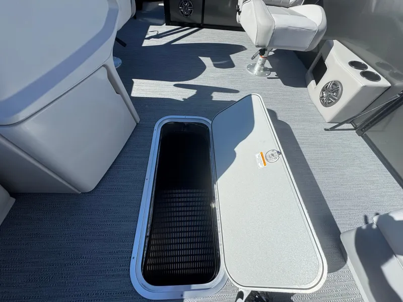 Slide: The Image of Open storage compartment on 2025 Godfrey EX2286SFLX boat deck. - 5