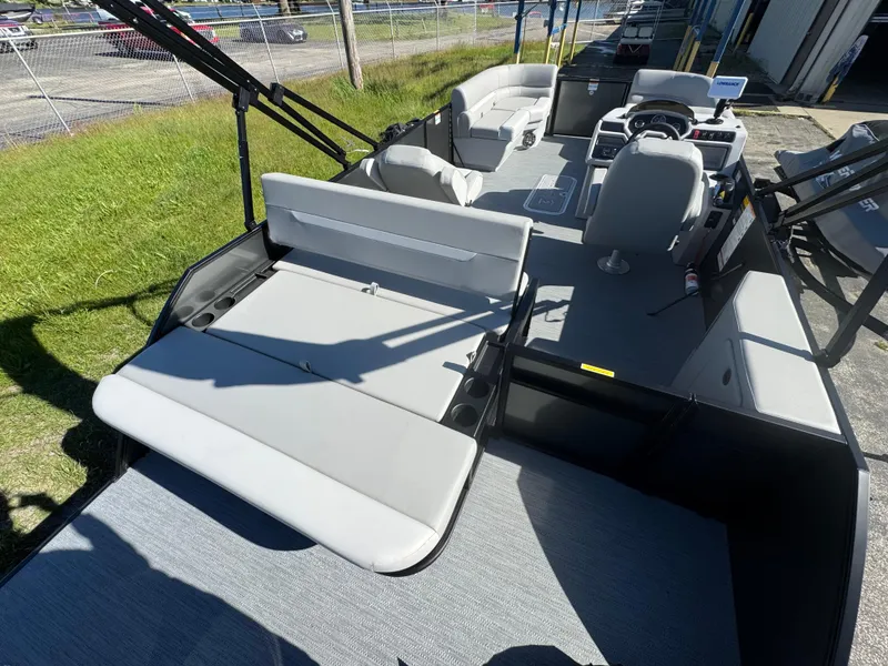 Slide: The Image of 2025 Godfrey EX2286SFLX pontoon boat interior with seating and steering console. - 8