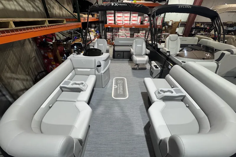 Slide: The Image of 2025 Godfrey Xperience EX2286SFLX pontoon boat interior with plush seating and modern design. - 9