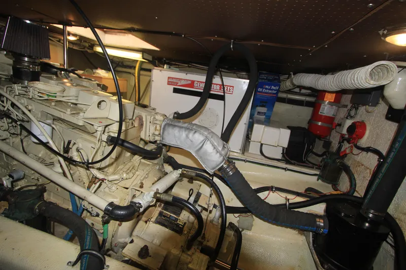 Slide: The Image of Engine room of 2000 Willard Marine 40 Flybridge Sedan Trawler, showcasing machinery and equipment. - 18