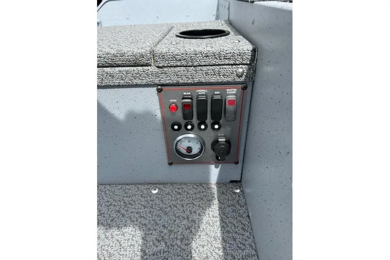 Slide: The Image of Control panel of 2025 Lund 1675 Alaskan Tiller boat with switches and gauge. - 15
